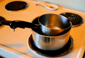 Double boiler on stove.