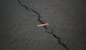 Band aid over a crack in the road. 