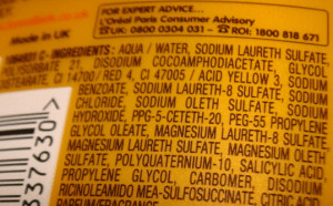 Close up ingredients label of yellow bottle.