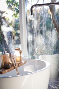 Bath running with window in background.