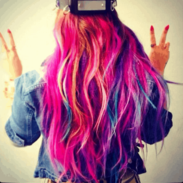 Back of woman's rainbow hair color.