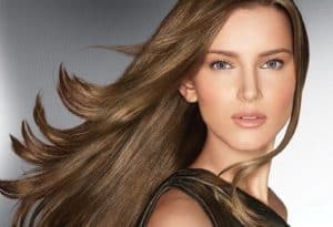 Woman with long sleek brown hair.