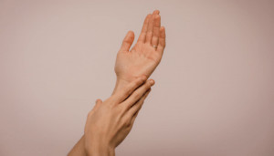 hands on a beige backdrop