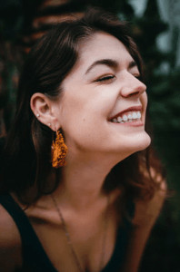 Woman with clear skin smiling. 