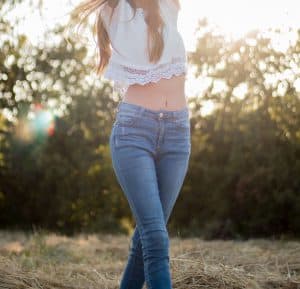 Woman walking with revealed midriff. 