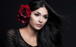 Woman with flower behind her ear.