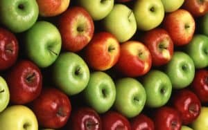 Rows of different colored apples.