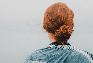 Back of girl with her hair in a bun.