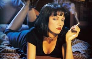 Uma thurman lying down and smoking in pulp fiction scene.