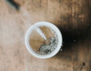 Tea being poured into a mug.