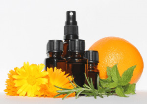 Essential oils with flower and orange. 