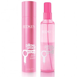 Spray bottle of Redken Pillow Proof Primer next to pink packaging.