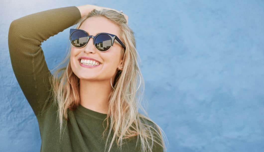 Woman smiling with sunglasses