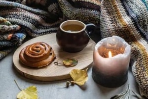 Tea, candle and danish