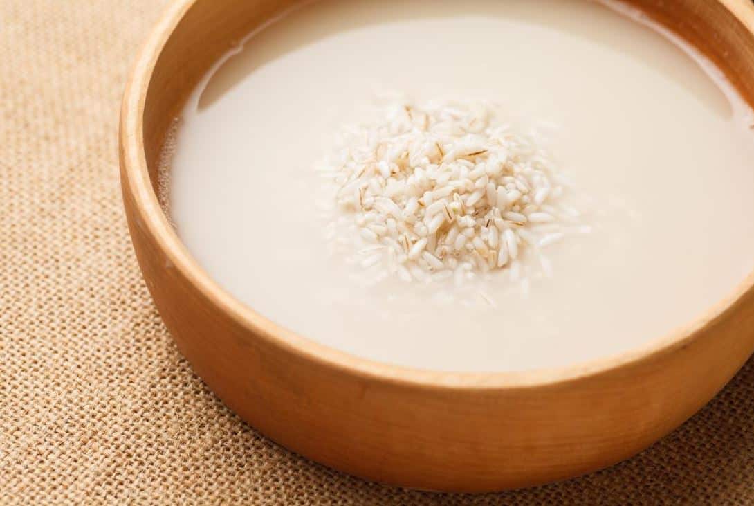 Rice soaking in a bowl of water.