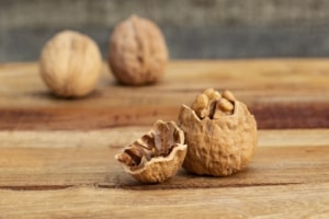 Cracked walnut on table.